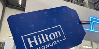 Yeah, No – Maybe Don’t Fall for that Hilton Amex Business Card Offer a blue and white sign with white text