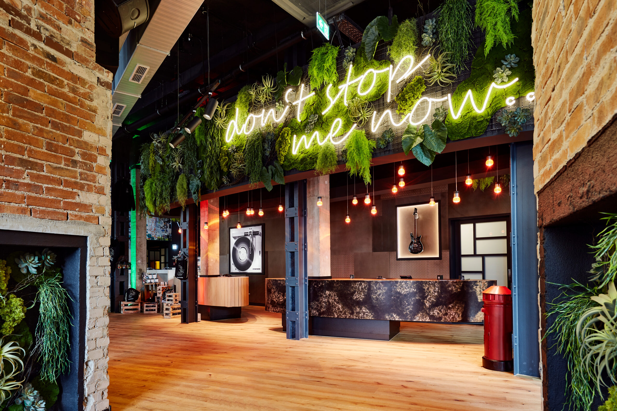 a room with a green wall and a reception desk