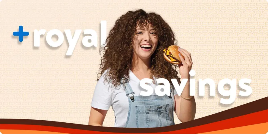 a woman holding a burger