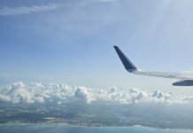 JetBlue Fare Sale, One-Way Flights from 3,800 Points an airplane wing above the water