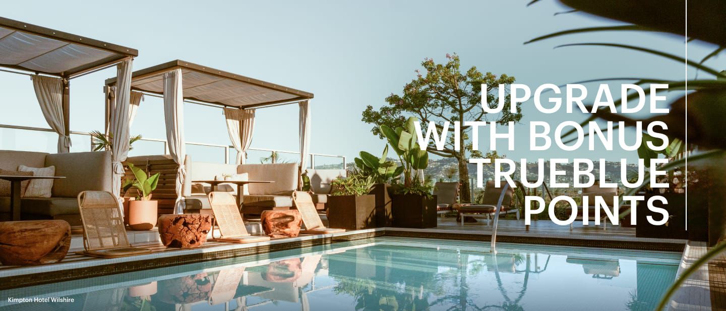 a pool with chairs and a table