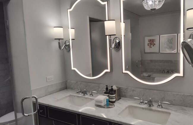 a bathroom with a mirror and sink