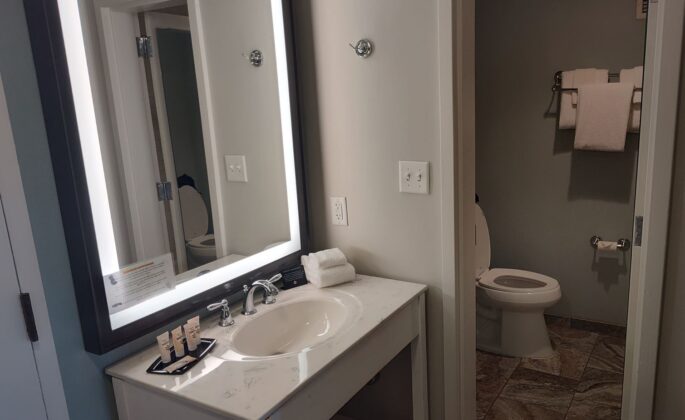 a bathroom with a mirror and sink