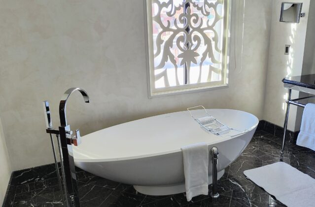 a white bathtub in a bathroom