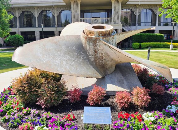a large propeller in a garden