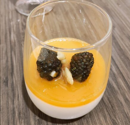 a glass with a dessert in it